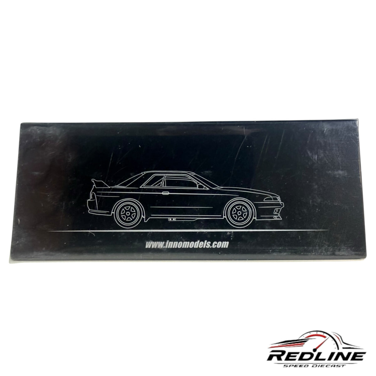Redline Speed Diecast black display box for Inno64 Nissan Skyline GT-R R32 model car with white line art graphic
