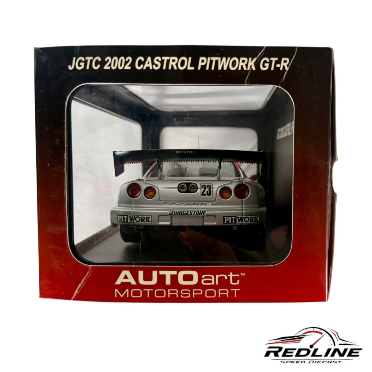 Redline Speed Diecast 1:18 scale AUTOart Nissan Skyline GT-R race car model in its original display box, rear view.
