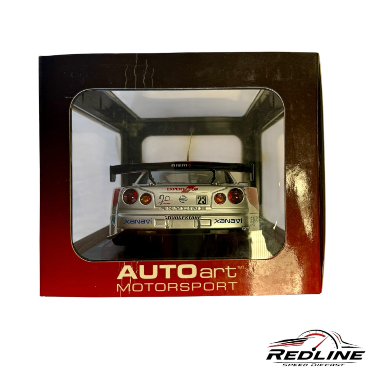 Redline Speed Diecast AUTOart 1:18 scale Nissan Skyline GT-R Xanavi NISMO racing model in display box, rear view