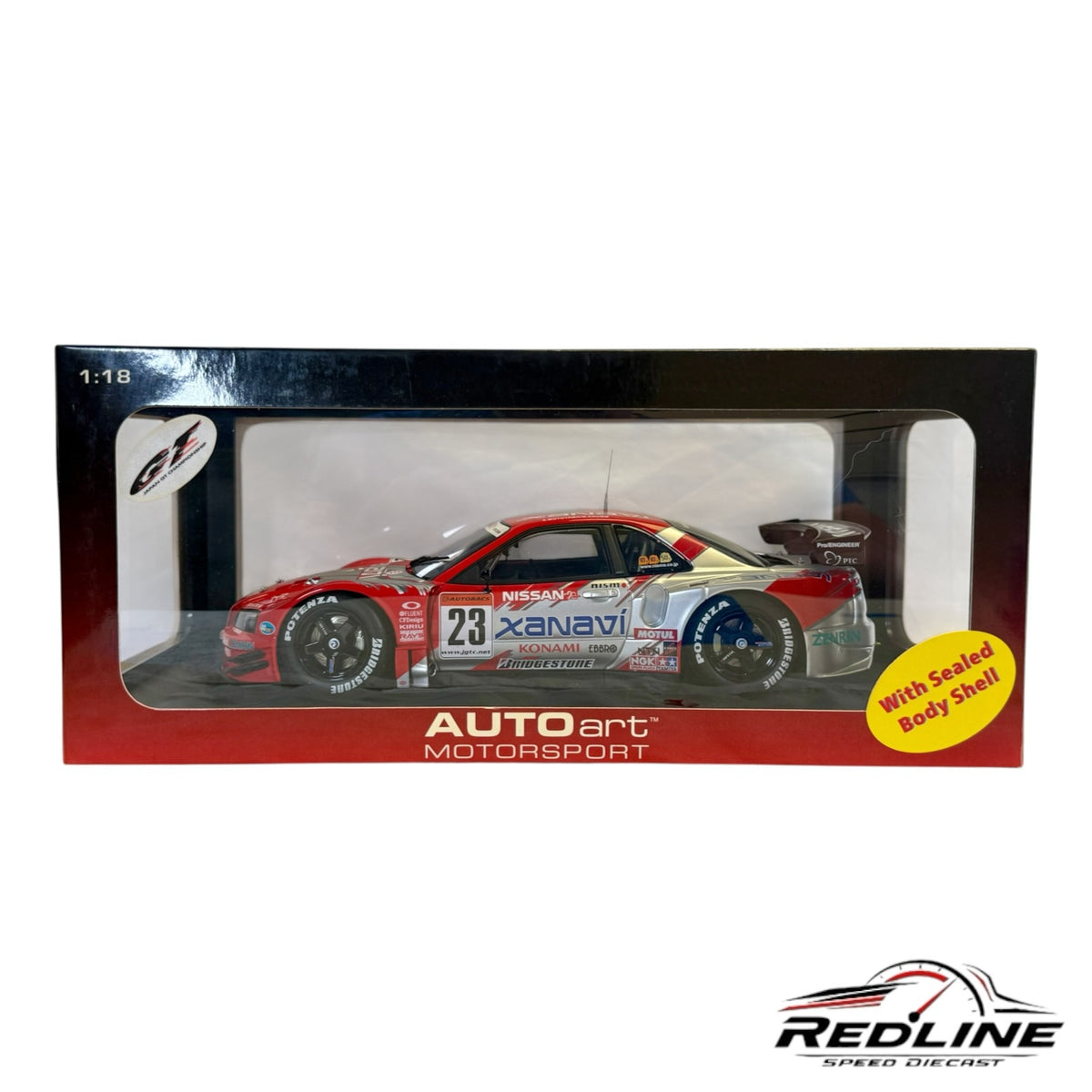 Redline Speed Diecast AUTOart 1:18 scale Nissan Skyline GT-R Xanavi NISMO racing model in red and silver livery.