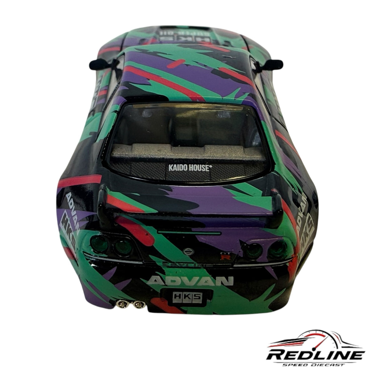 Redline Speed Diecast Nissan Skyline GT-R R33 HKS model car featuring vibrant purple and green racing livery