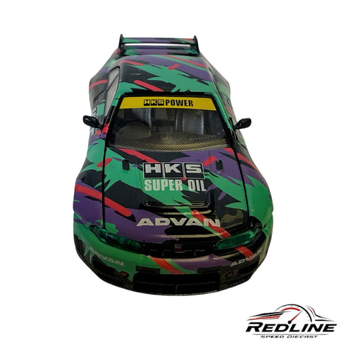 Redline Speed Diecast 1:64 scale Nissan Skyline GT-R R33 model with HKS livery, green and purple racing graphics.
