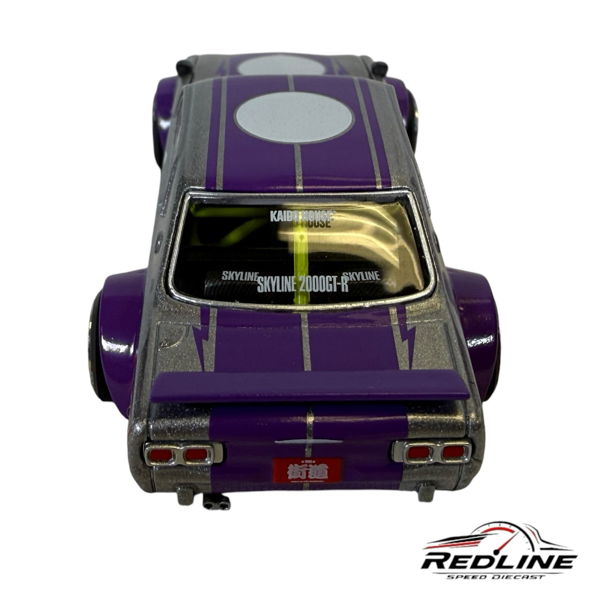 Redline Speed Diecast Nissan Skyline 2000GT-R Kaido Works model in silver and purple with wide-body rear view