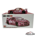 Redline Speed Diecast Kaido House Nissan Skyline GT-R R34 model in metallic pink with racing decals and wide-body kit.