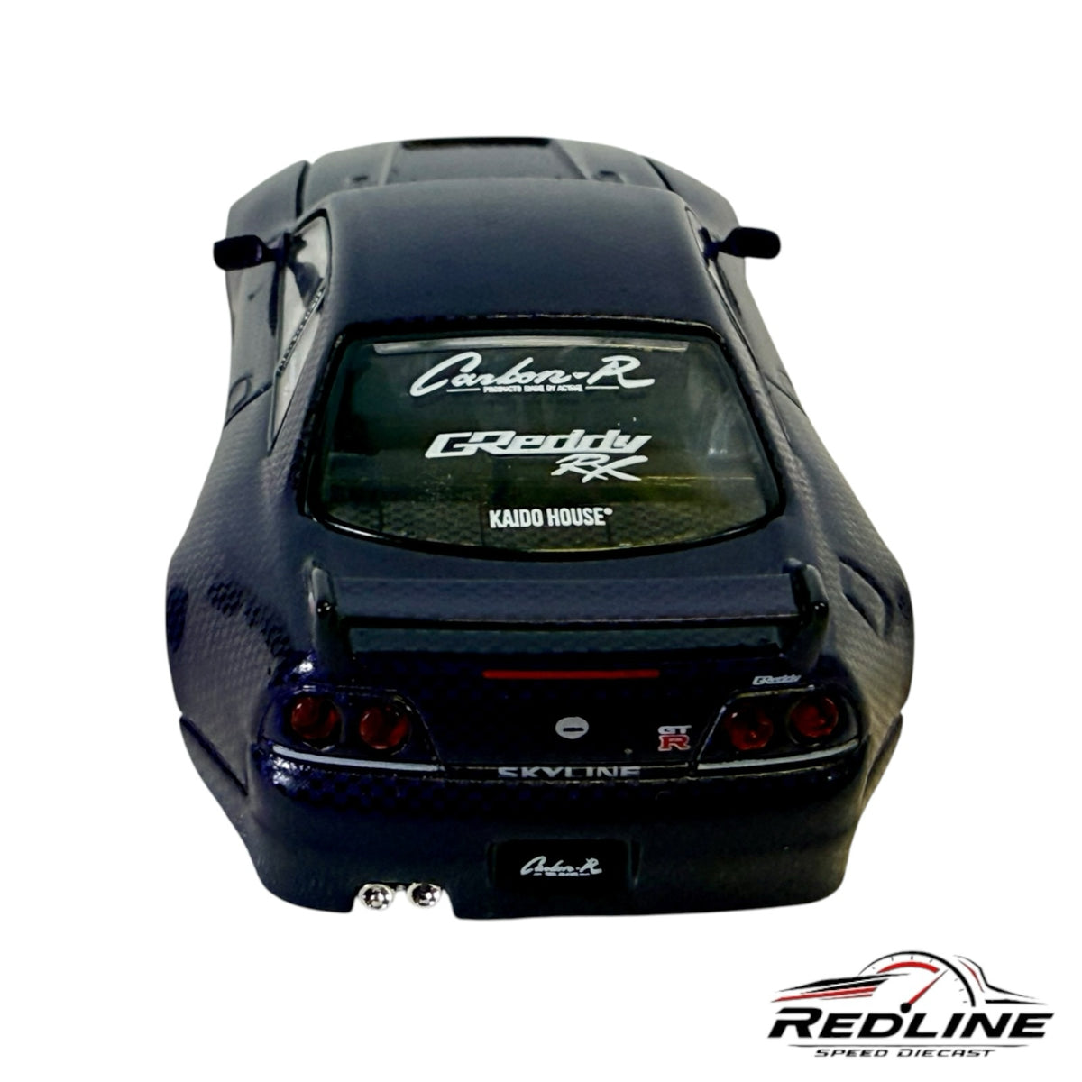 Redline Speed Diecast Nissan Skyline GT-R R33 model car with carbon fiber finish, GReddy livery, and rear view.