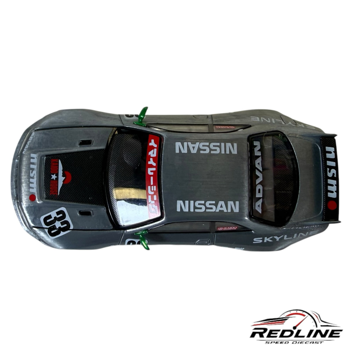 Redline Speed Diecast 1:64 scale Nissan Skyline GT-R R33 Imai Racing model car in metallic silver with Advan livery