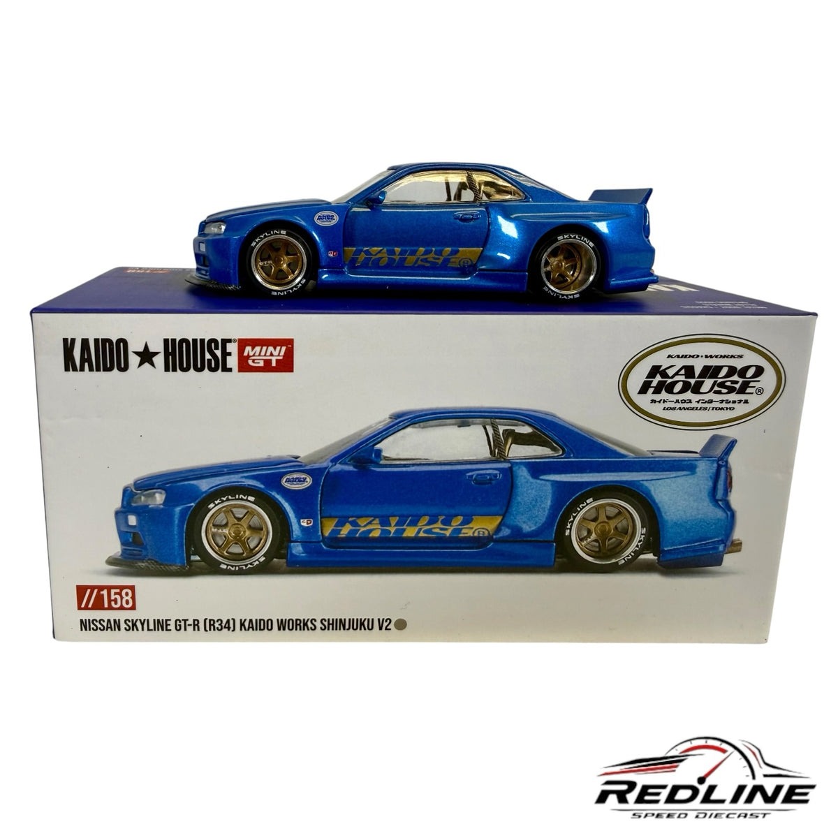 Redline Speed Diecast metallic blue Nissan Skyline GT-R R34 Kaido Works model car with gold wheels on display box