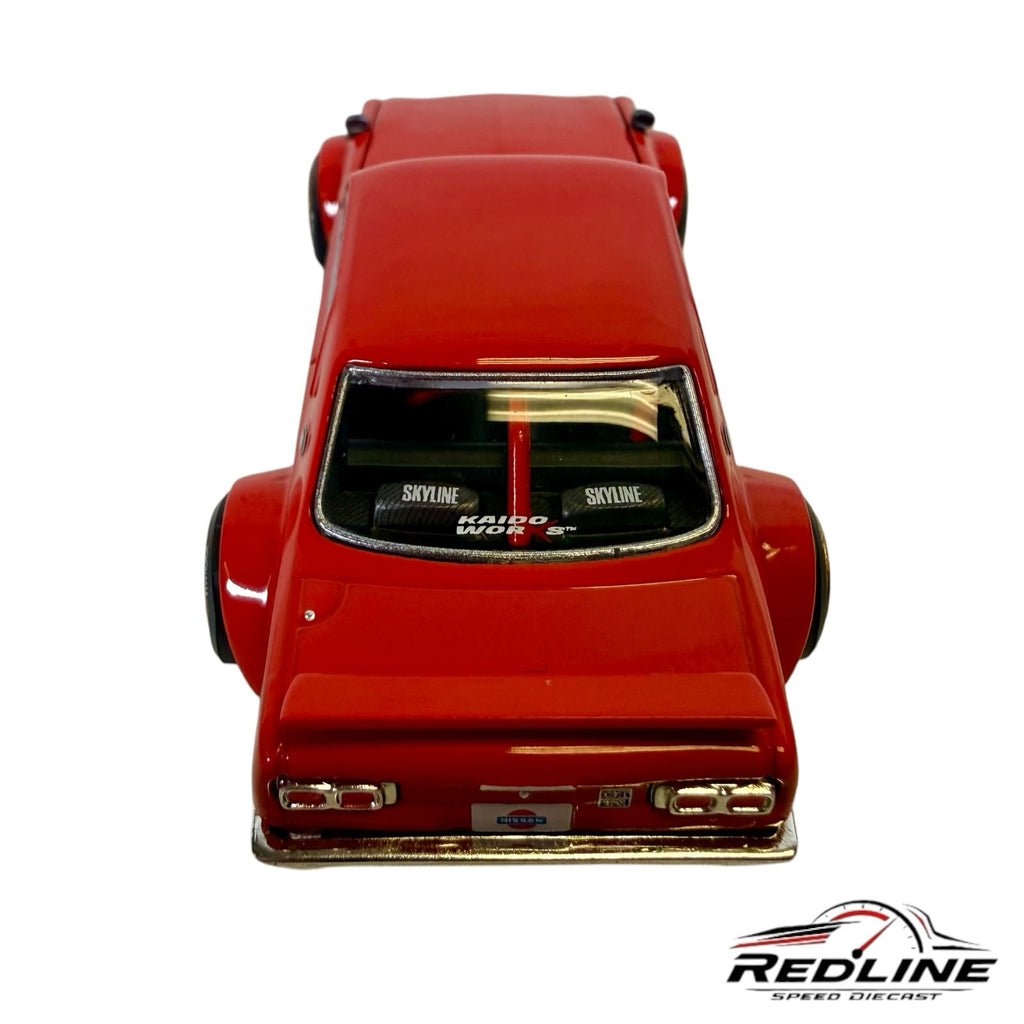 Redline Speed Diecast Nissan Skyline 2000GT-R diecast model in red with wide-body fenders and rear window branding