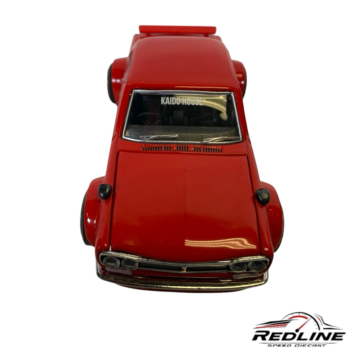 Redline Speed Diecast KAIDO HOUSE Nissan Skyline 2000GT-R model car in high-gloss red with wide-body fenders.