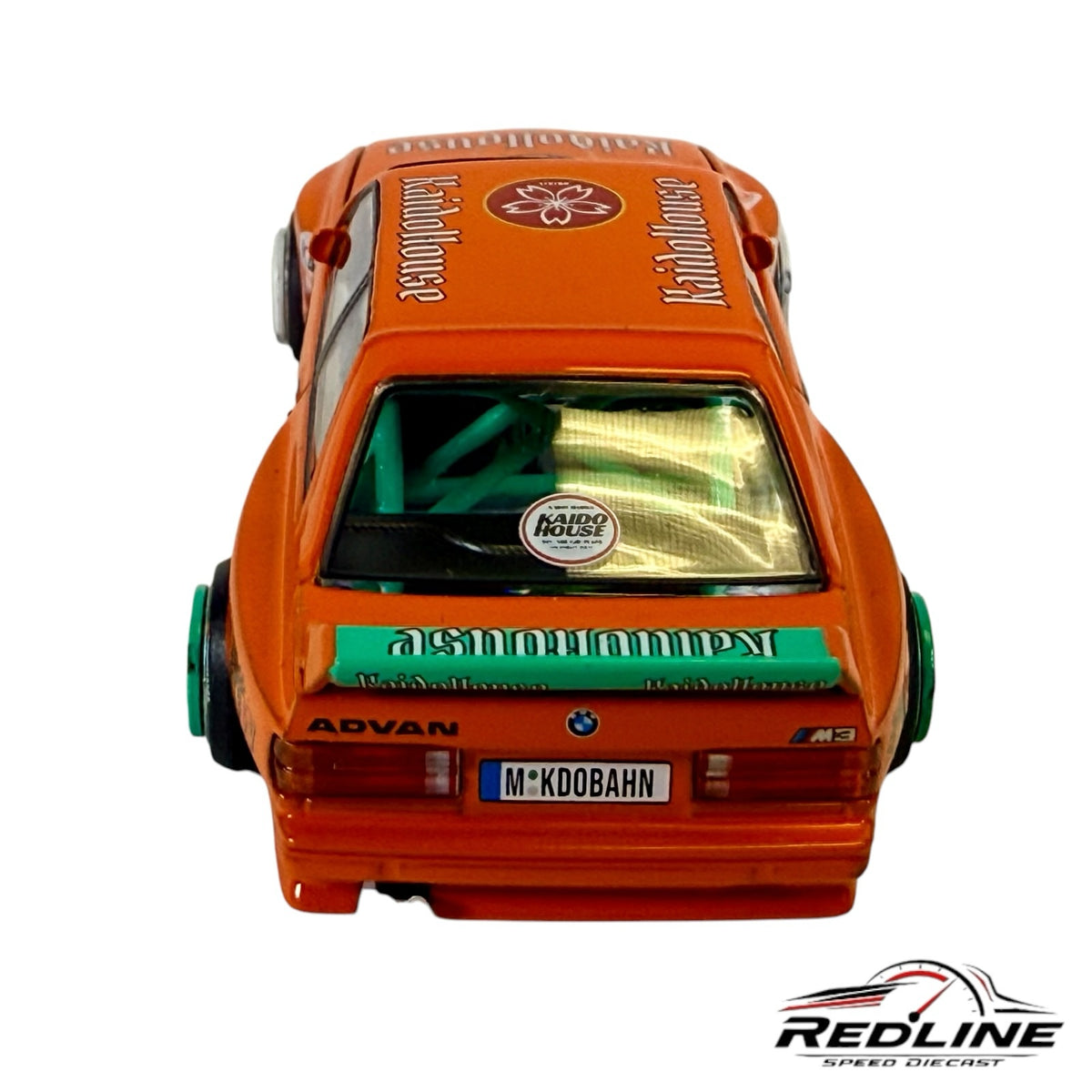 Redline Speed Diecast 1:64 scale orange BMW M3 model car with teal roll cage and Kaido House racing decals