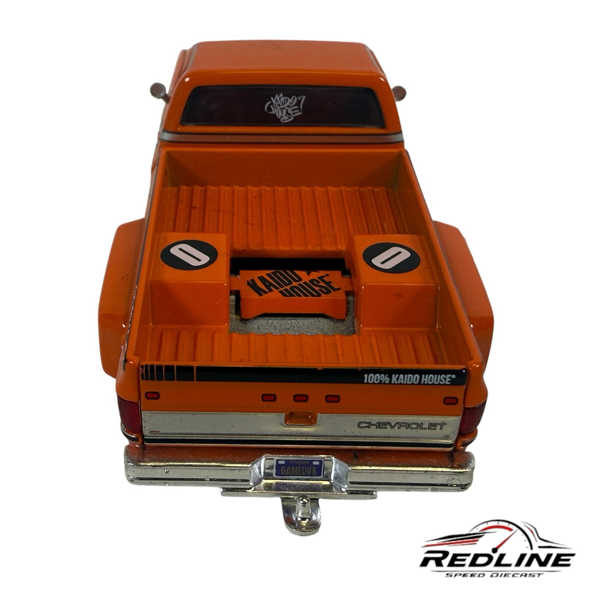 Redline Speed Diecast orange 1983 Chevrolet Silverado pickup truck model with Kaido House racing livery and bed detail