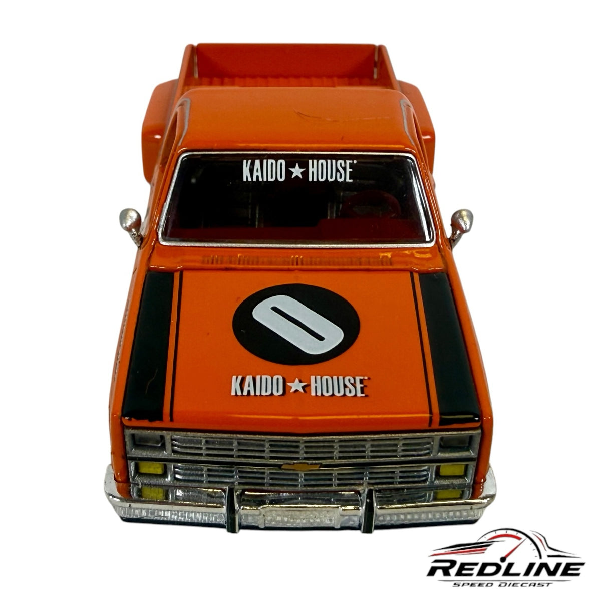 Redline Speed Diecast KAIDO HOUSE 1983 Chevrolet Silverado pickup truck in orange with racing livery and chrome trim.