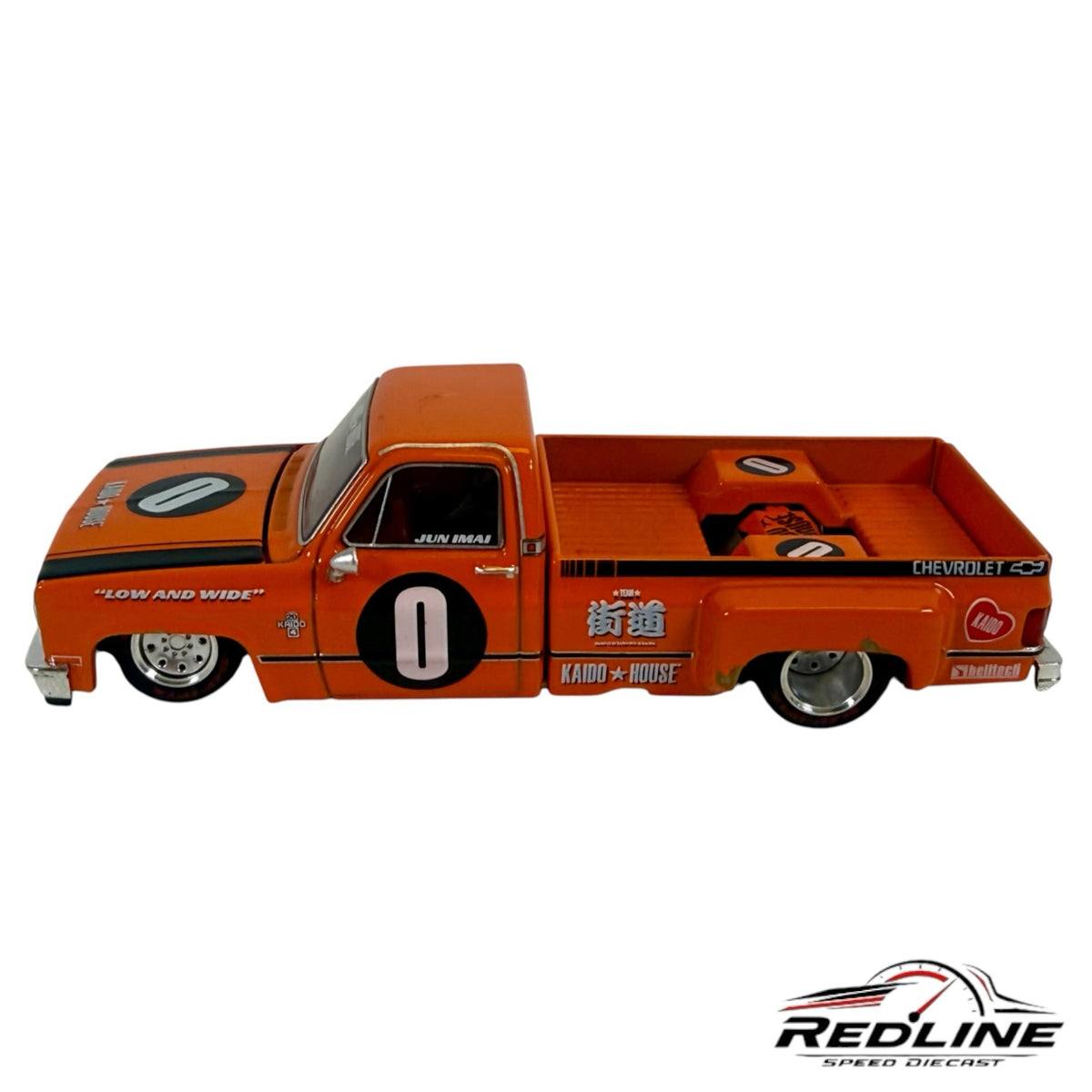 Redline Speed Diecast KAIDO HOUSE 1983 Chevrolet Silverado orange custom pickup truck with racing livery and deep-dish wheels