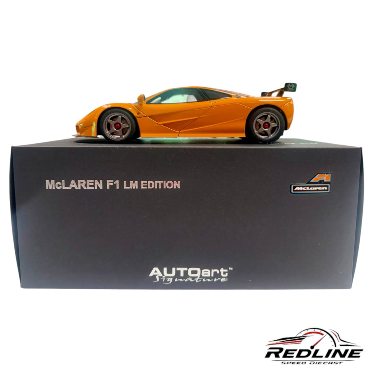 Redline Speed Diecast 1:18 scale orange McLaren F1 LM model car displayed on its branded black collector box