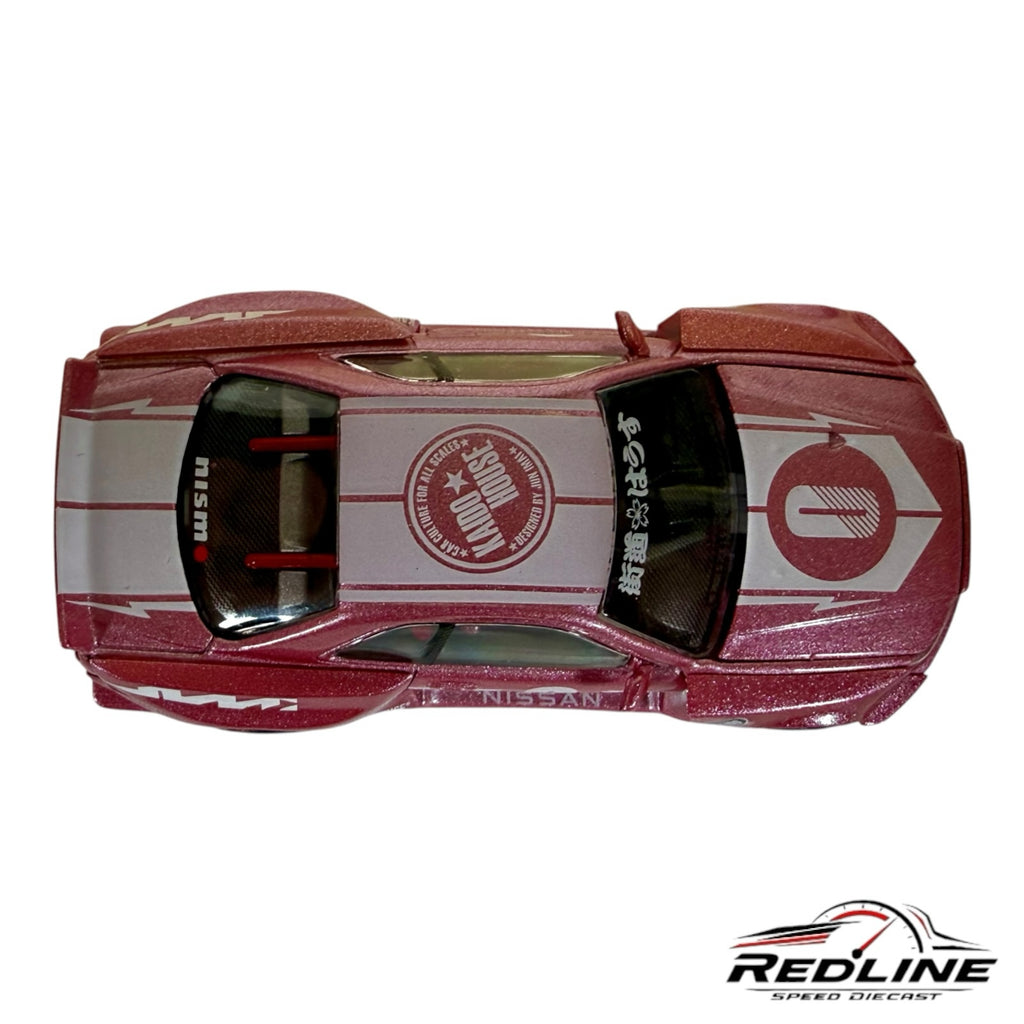 Redline Speed Diecast metallic pink Nissan Skyline GT-R R34 wide-body model car with racing decals, top-down view