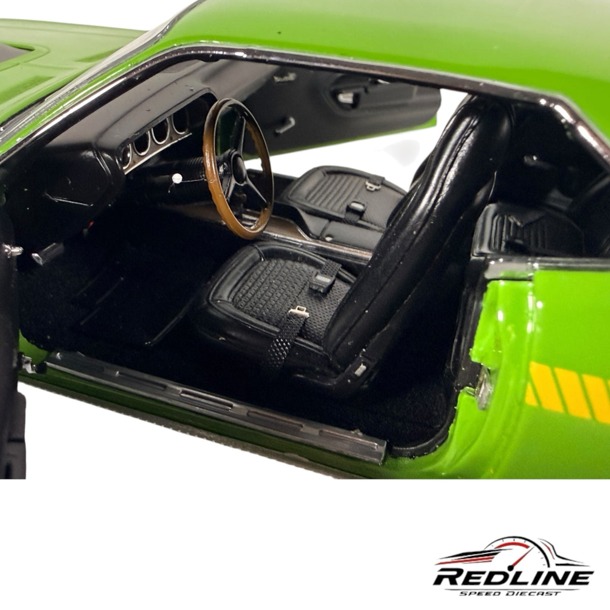 Redline Speed Diecast 1970 Plymouth Cuda model interior with black bucket seats, wood-rimmed steering wheel, and dash.