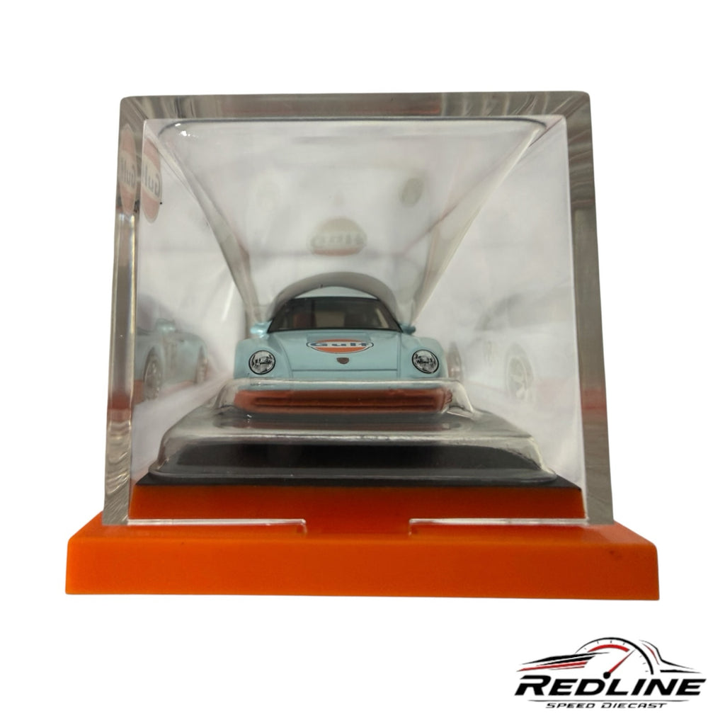 Redline Speed Diecast Hot Wheels Porsche 959 in Gulf livery inside a clear acrylic display case on an orange base