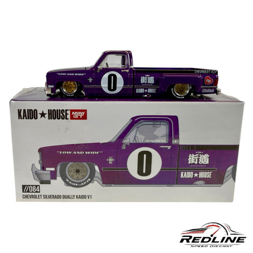 Redline Speed Diecast 1:64 scale purple Chevrolet Silverado Dually model truck with gold wheels and racing graphics.