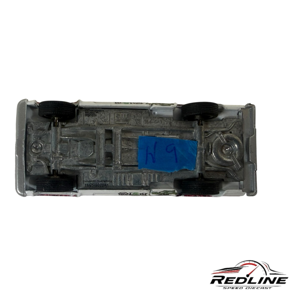 Underside view of a Redline Speed Diecast Rat Fink custom pickup truck model showing metal chassis and black wheels