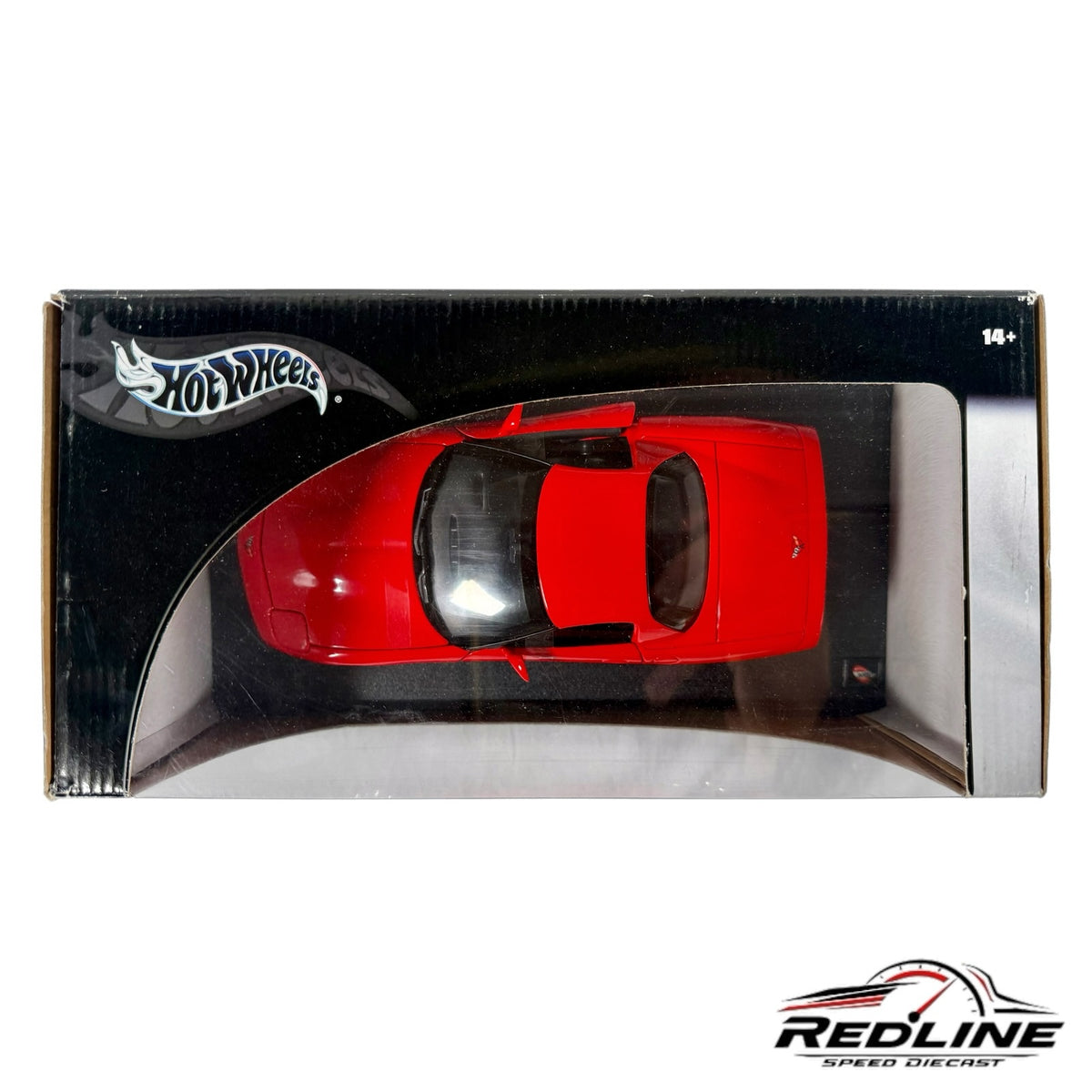 Redline Speed Diecast Hot Wheels Corvette C5 model car in vibrant red, viewed from above in its collector box.