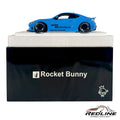 Redline Speed Diecast blue Rocket Bunny widebody sports car model with flared fenders on a display base