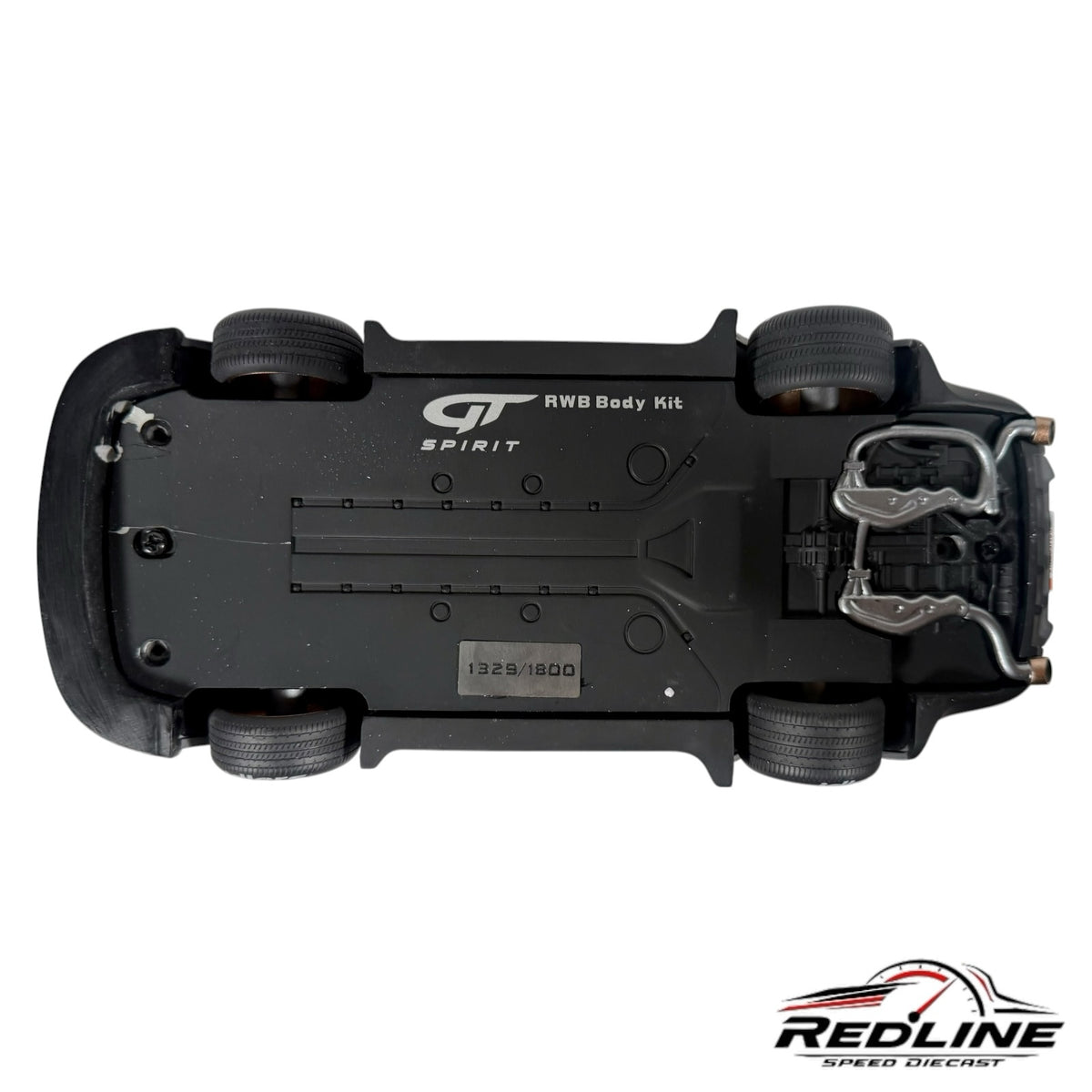 Underside view of Redline Speed Diecast 1:18 scale RWB Porsche model showing chassis, exhaust, and limited edition tag