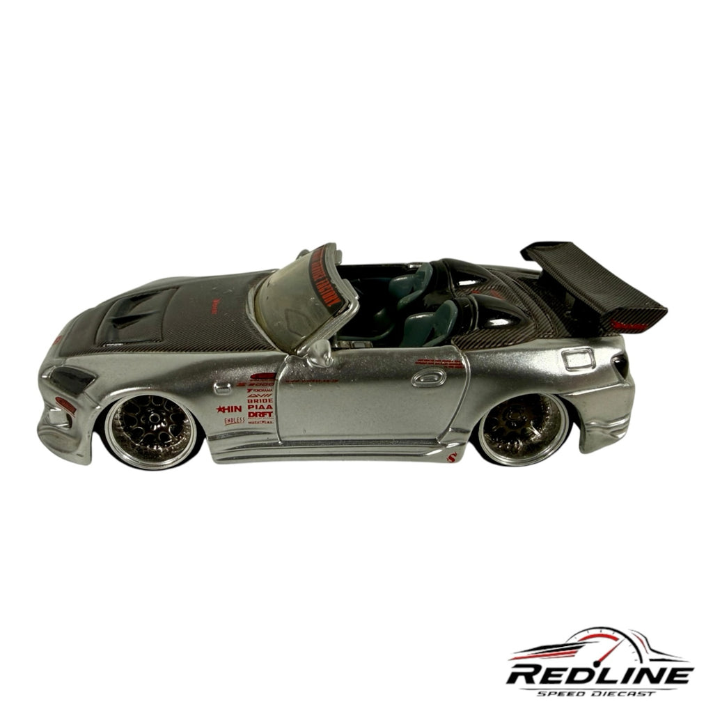 Redline Speed Diecast silver Honda S2000 custom tuner model with carbon fiber hood, wide-body kit, and rear wing.