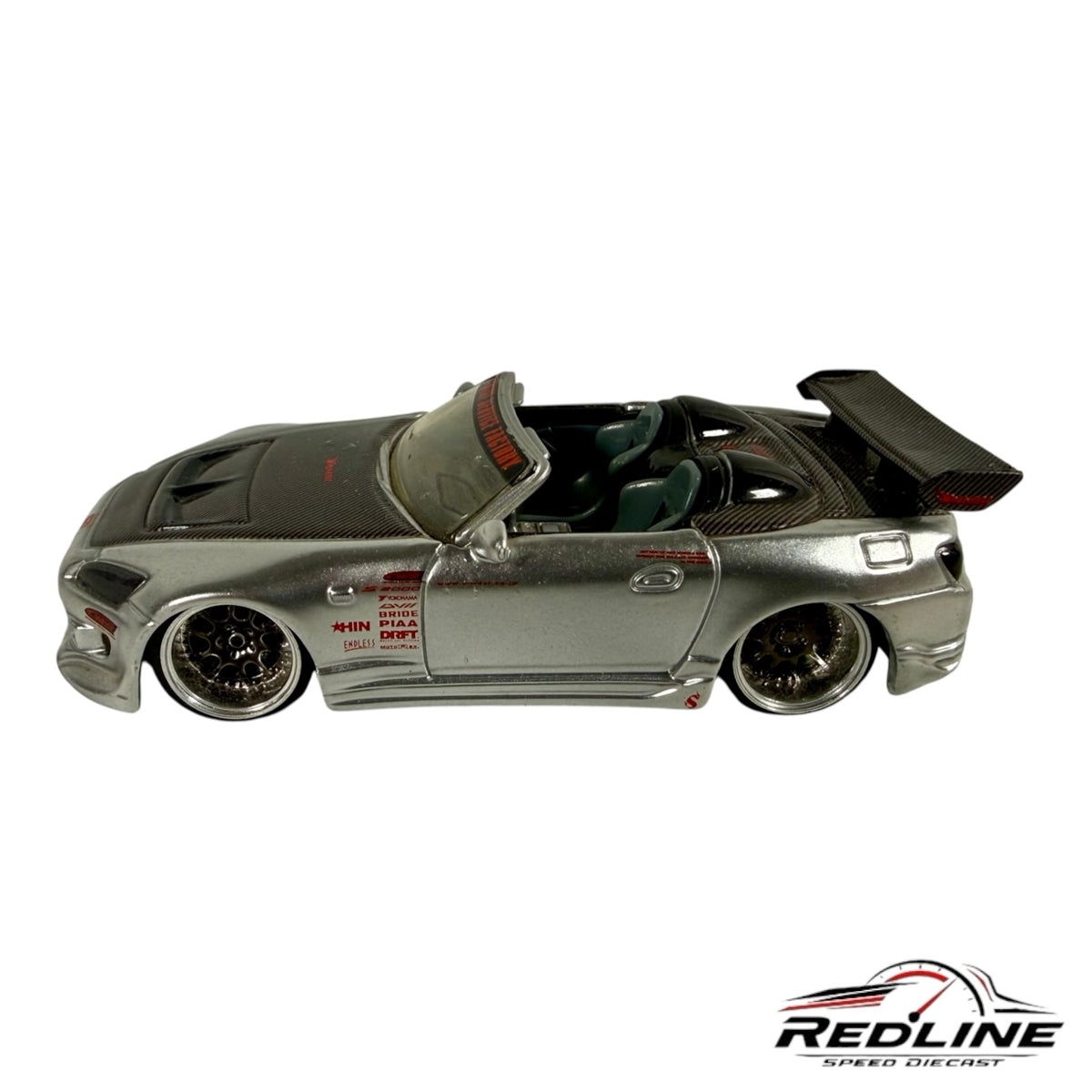 Redline Speed Diecast silver Honda S2000 custom tuner model with carbon fiber hood, wide-body kit, and rear wing.