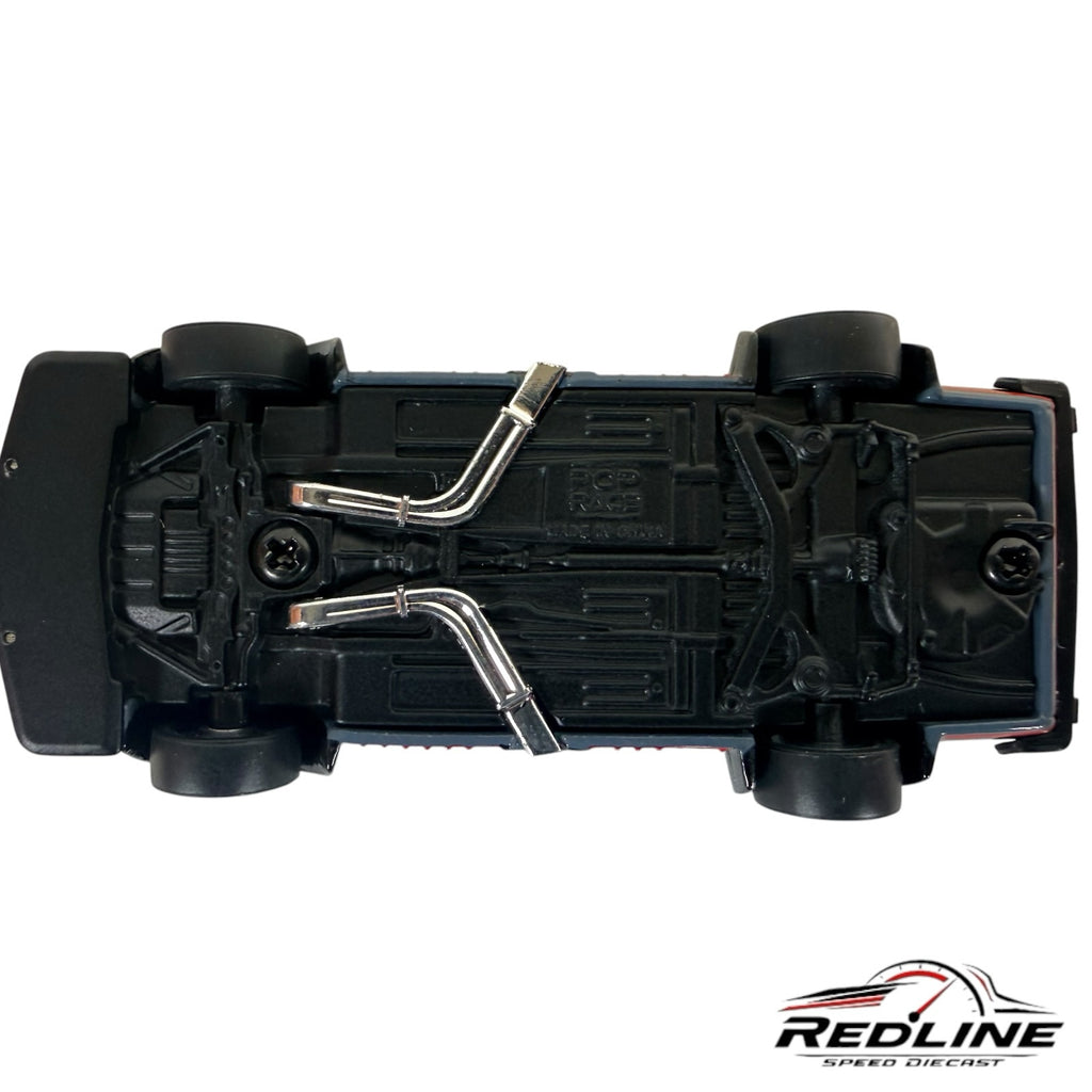 Underside view of Redline Speed Diecast 1/64 scale Skyline GT-R V8 Drift model showing chrome exhaust and chassis