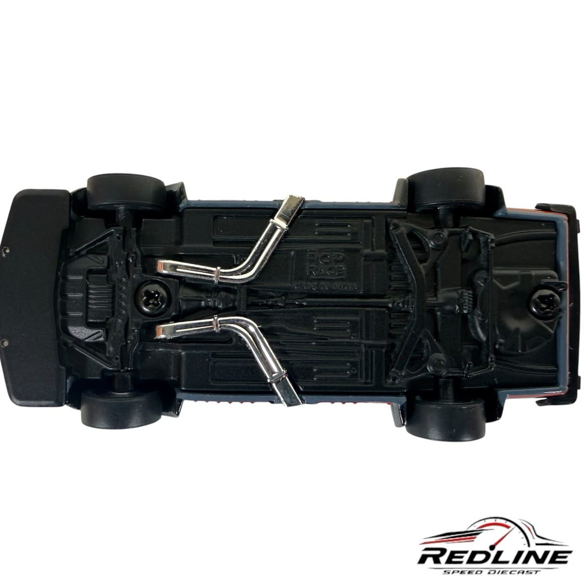 Underside view of Redline Speed Diecast 1/64 scale Skyline GT-R V8 Drift model showing chrome exhaust and chassis