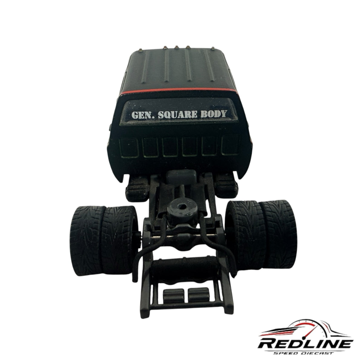 Rear view of a Redline Speed Diecast custom square body pickup truck model with dually rear wheels and black chassis.