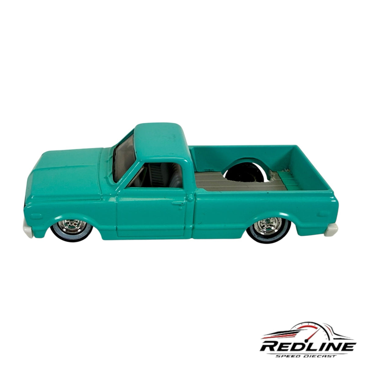 Redline Speed Diecast 1968 Chevy C10 pickup truck model in vibrant teal with a lowered stance and chrome wheels.