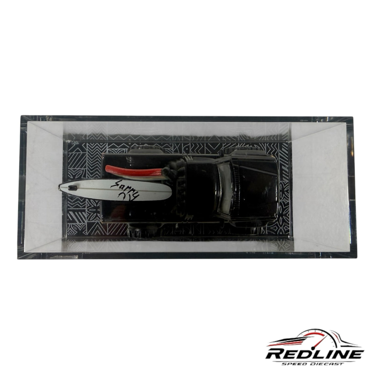 Redline Speed Diecast Hot Wheels Evan Mock 1987 Toyota Pickup in black with surfboard in acrylic display case