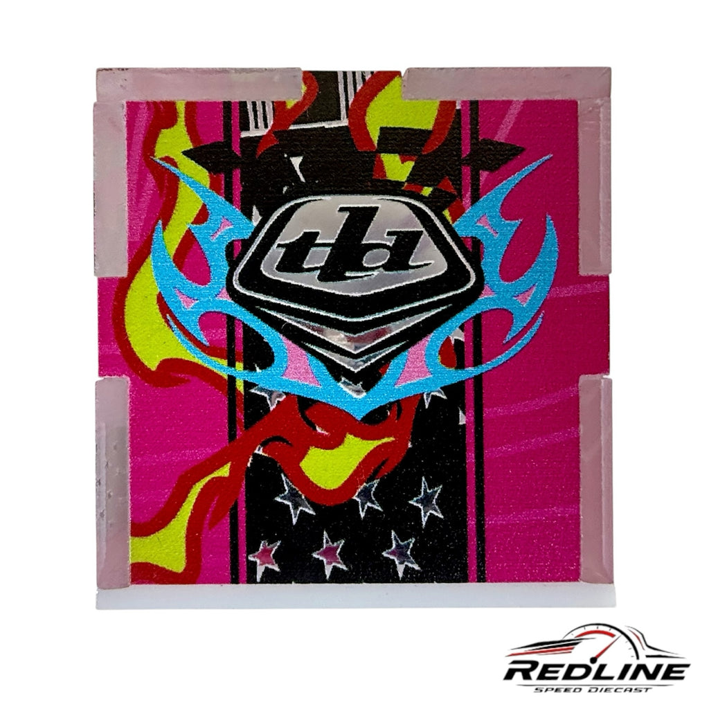 Redline Speed Diecast Troy Lee Designs collectible featuring vibrant pink, yellow, and blue flame and star graphics.