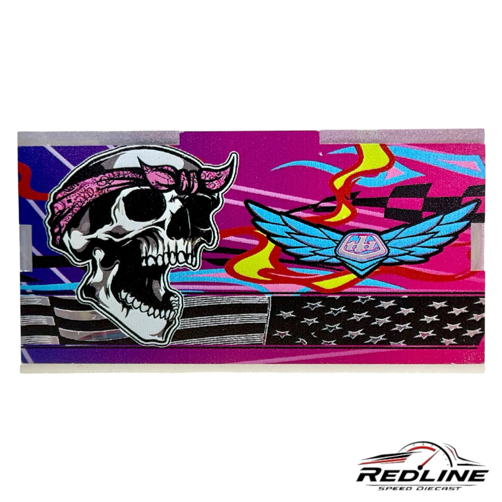 Redline Speed Diecast Troy Lee Designs collectible featuring a skull, wings, and American flag graphic in vibrant pink