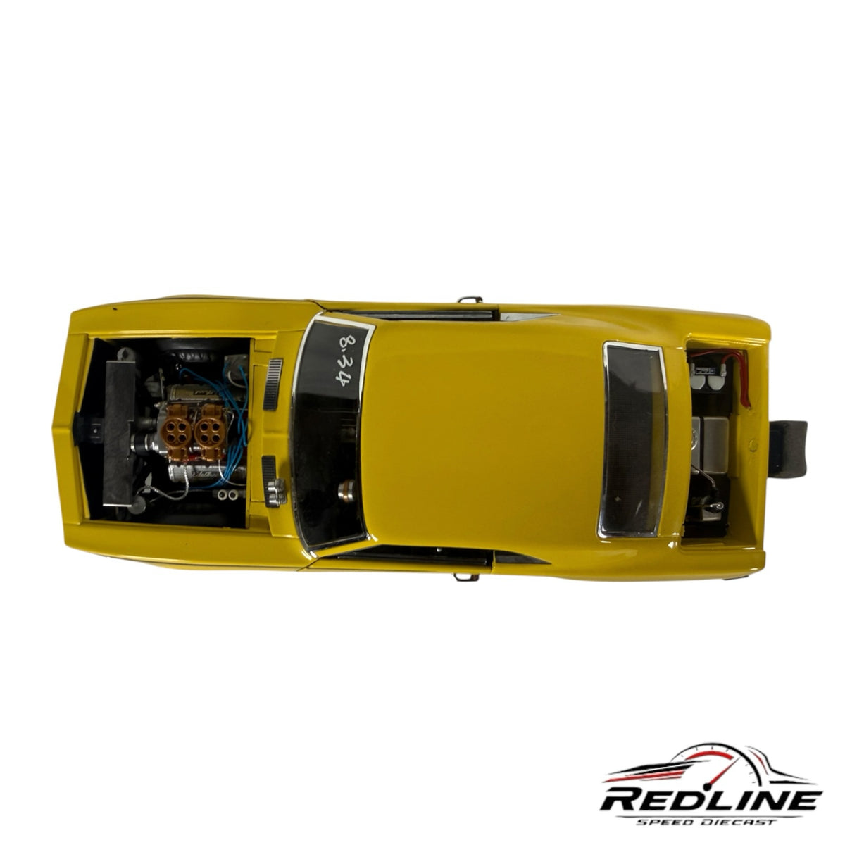 Top view of a Redline Speed Diecast 1969 Chevrolet Camaro Pro Street model car in vibrant yellow with an open hood.