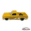 Redline Speed Diecast 1983 Chevy Silverado pickup truck in yellow with side graphics and black wheels