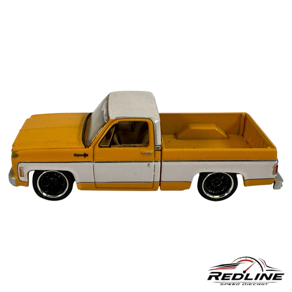 Redline Speed Diecast 1970s Chevrolet Cheyenne pickup truck model in two-tone yellow and white with custom wheels