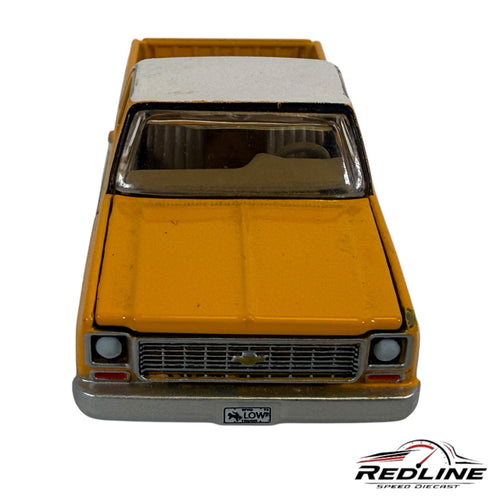 Redline Speed Diecast vintage Chevrolet Cheyenne pickup truck model in two-tone yellow and white with custom wheels